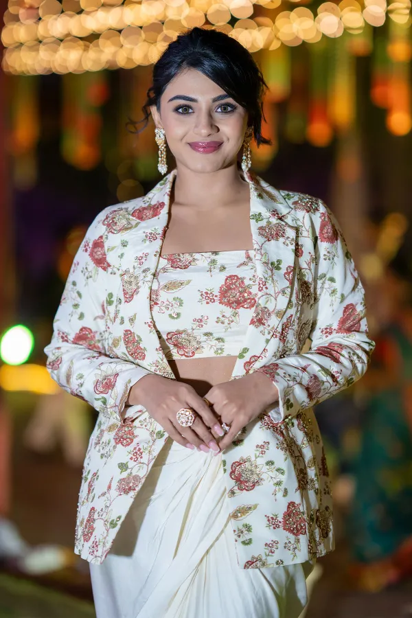 Nayan Sarika Stuns in a Blazer Saree at Rakasa Song Launch