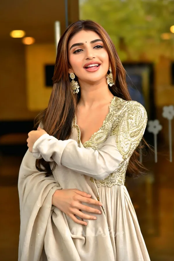 Sreeleela Traditional Fashion: White & Gold Anarkali Suit Stills