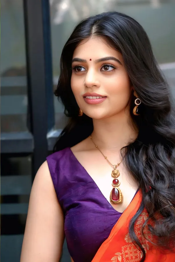 Bandhavi Sridhar Stills in Orange Saree at Saira Banu Launch